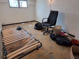 a room that has a bed and a chair in it