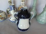 many vases that are sitting on a table