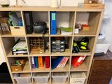 a book shelf with a bunch of books on top of it