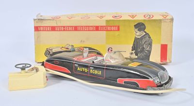 an image of a toy car with a man in the driver ' s seat in front of a box
