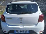 a white car parked on the side of the road