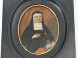 painting of a nun holding a skull in a black frame