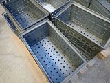 four metal bins stacked on top of each other