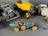 many different types of toy cars on the table