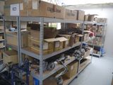 many boxes and tools on the shelves in the room