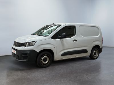 the white van is parked in a room with a white wall