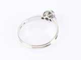 a close up of a silver ring with a skull on top of it