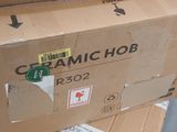 boxes stacked on top of each other with stickers on them