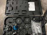 a black case with tools inside of it on the floor