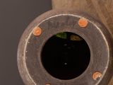 a close up of a vase with a hole in it