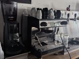 a coffee machine sitting on a counter in a coffee shop