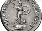 a silver coin with a statue of a man holding a sword