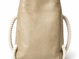a beige canvas bag with rope handles and a handle