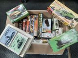 a cardboard box filled with assorted items on the floor