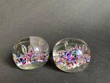 two clear glass bowls with colorful confetti and sprinkles on them