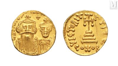 a gold coin with an image of a man and a woman on it