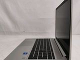 an open laptop computer sitting on top of a white surface