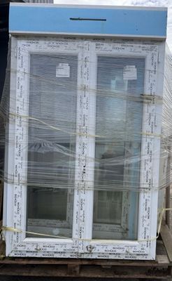 a large window sitting on top of a pallet in a warehouse