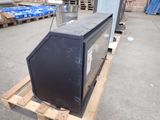 an image of a refrigerator sitting on a pallet in a warehouse