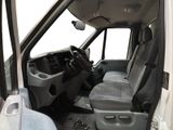 the interior of a van with the door open and the driver ' s seat down