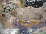 a pile of clothes and other items wrapped in plastic