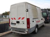 a white van that is parked in a parking lot