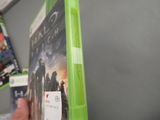 someone is holding a green case with a game on it
