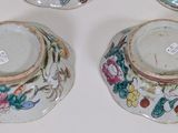 three small vases are sitting on a table with a white background