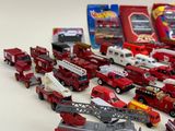 a lot of toy cars that are on the table