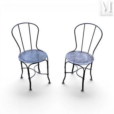 pair of metal chairs with blue upholstered seats on a white background
