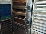 many racks of food that are in a kitchen