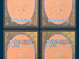 four decks of magic the gathering are shown on a blue background