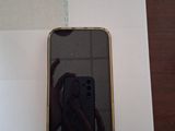 a person taking a picture of a cell phone in a box
