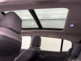 a view of the sunroof from inside of a car