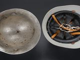 a silver bowl and a silver bowl on a black table