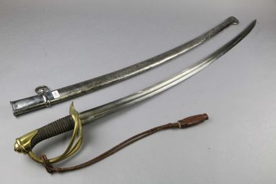 two swords are laying next to each other on a white surface