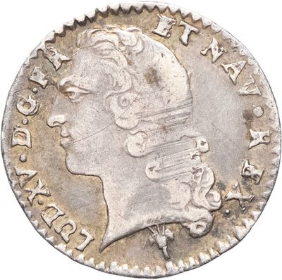 gros plan d'une pièce de monnaie sur laquelle figure une tête de femme