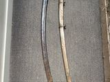 two swords in a box on the floor