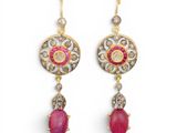 a pair of ruby and diamond earrings