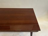 a walnut coffee table with a black metal legs and a wooden top