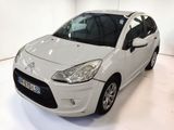 a picture of a small white car in a white room