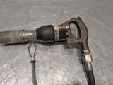 a pipe cutter and a wrenet on a metal surface