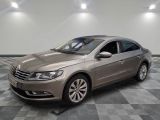 the volkswagen passat is parked on a checkered tile floor