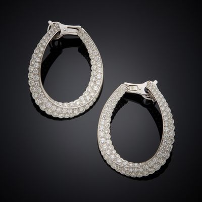 a pair of diamond hoop earrings