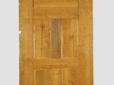 an old wooden door with a glass paneled window and green trim