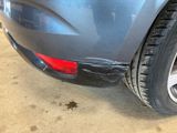 a close up of a car that has been dented