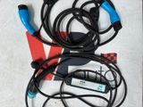 two cables connected to a charger on a table