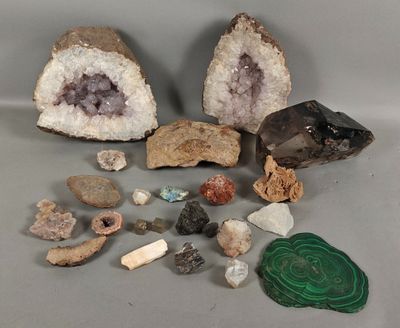 several different types of rocks and stones on a gray surface