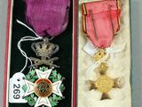a small box with a medal and a medal on it