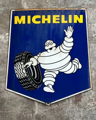 a michel michel tire sign on the side of a building